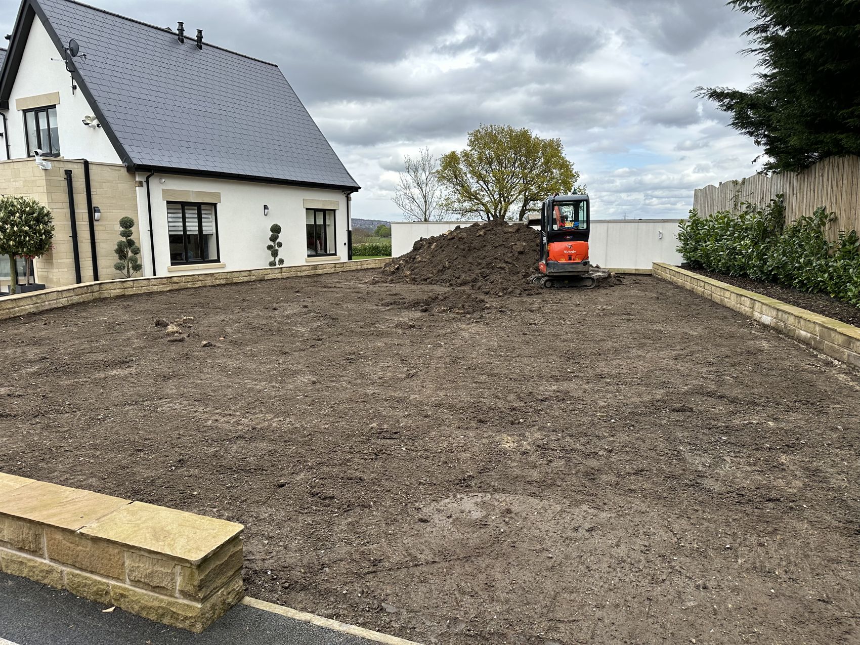 Old lawn dug out and levelled ready for a new base