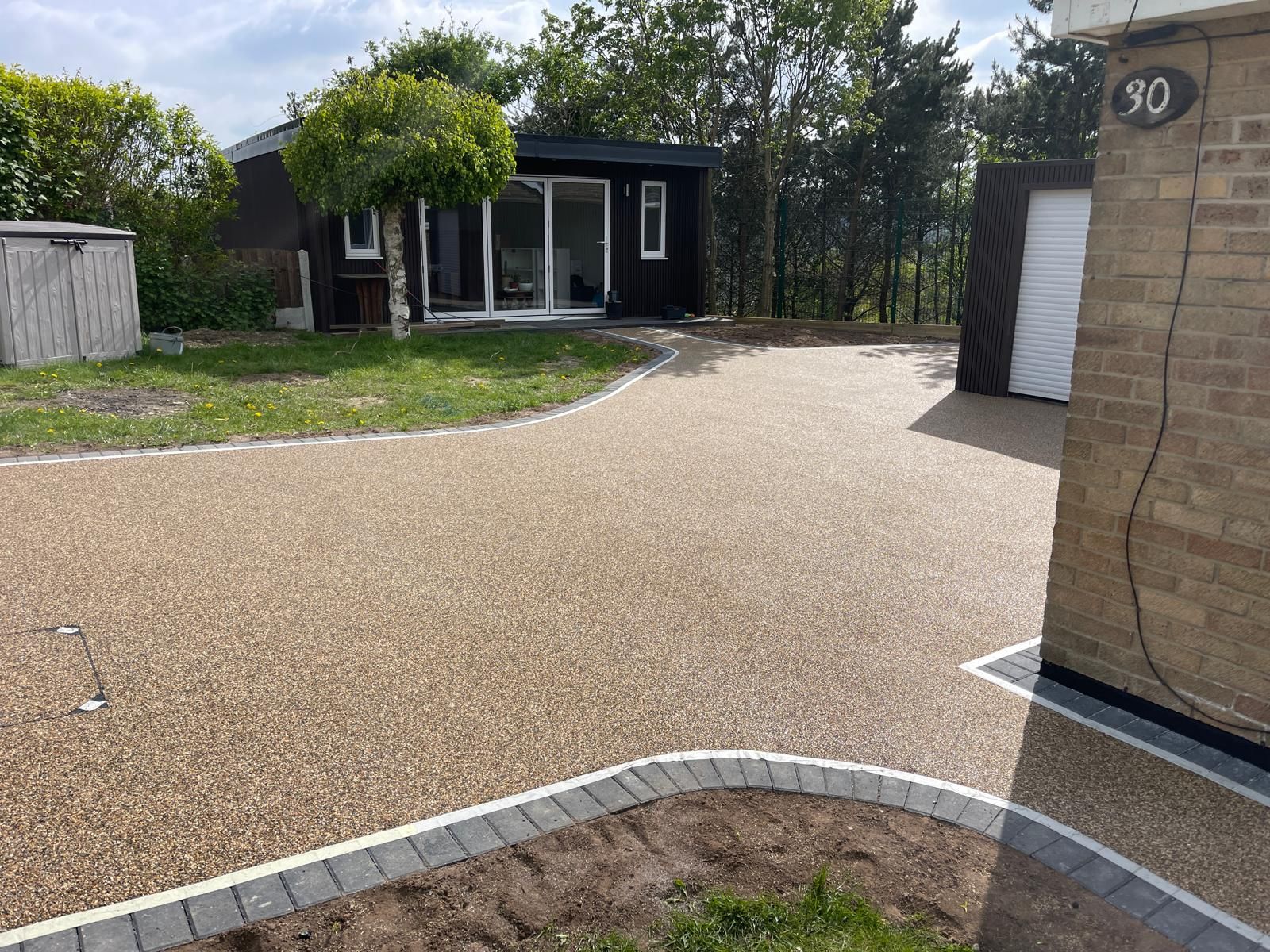 Resin driveway with garden room and pathway